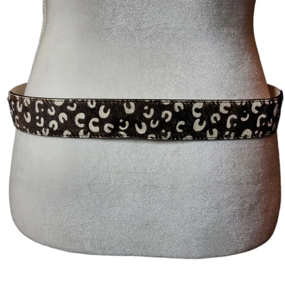 100% calf hair leather‎ dark brown, white spotted belt.